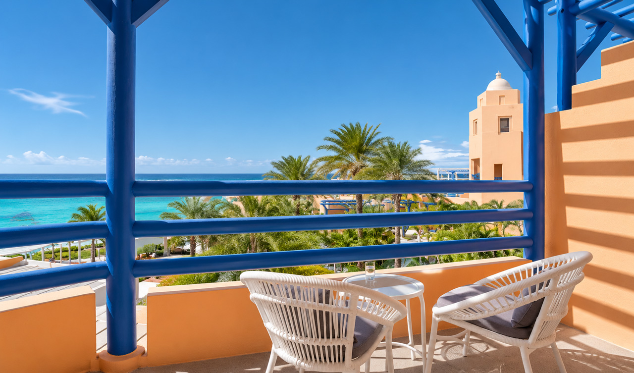 Balcony with sea view and outdoor seating.