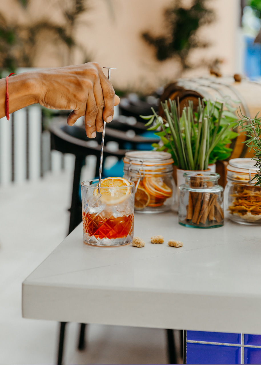 Bartender preparing a signature cocktail - No Smoke without Fire.