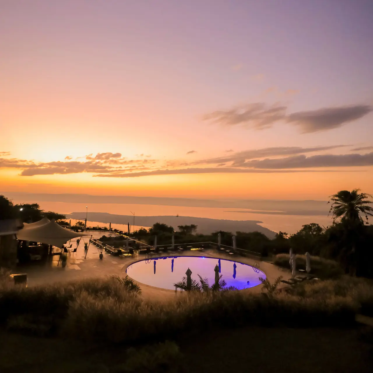 Sunset over the pool and Lake Ihema at SALT of Akagera.