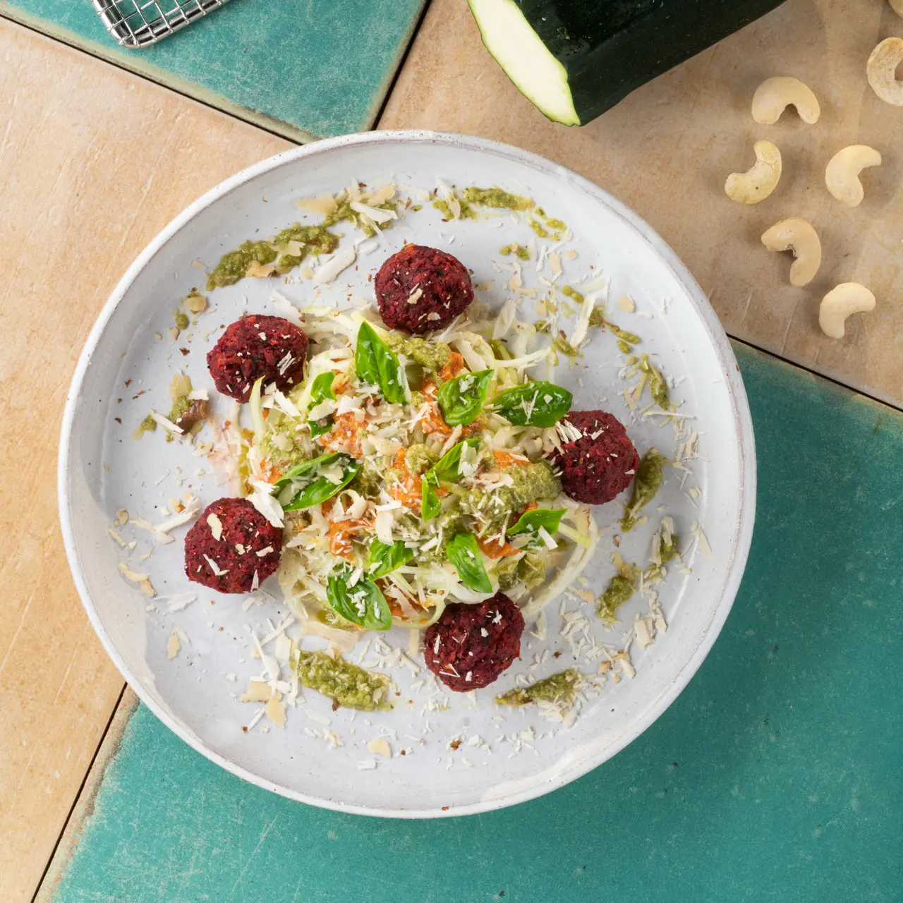 Raw vegetable pasta with beetroot bites.