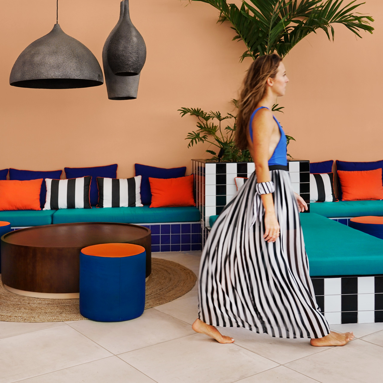 Guest walking through the colourful Pool Bar lounge.