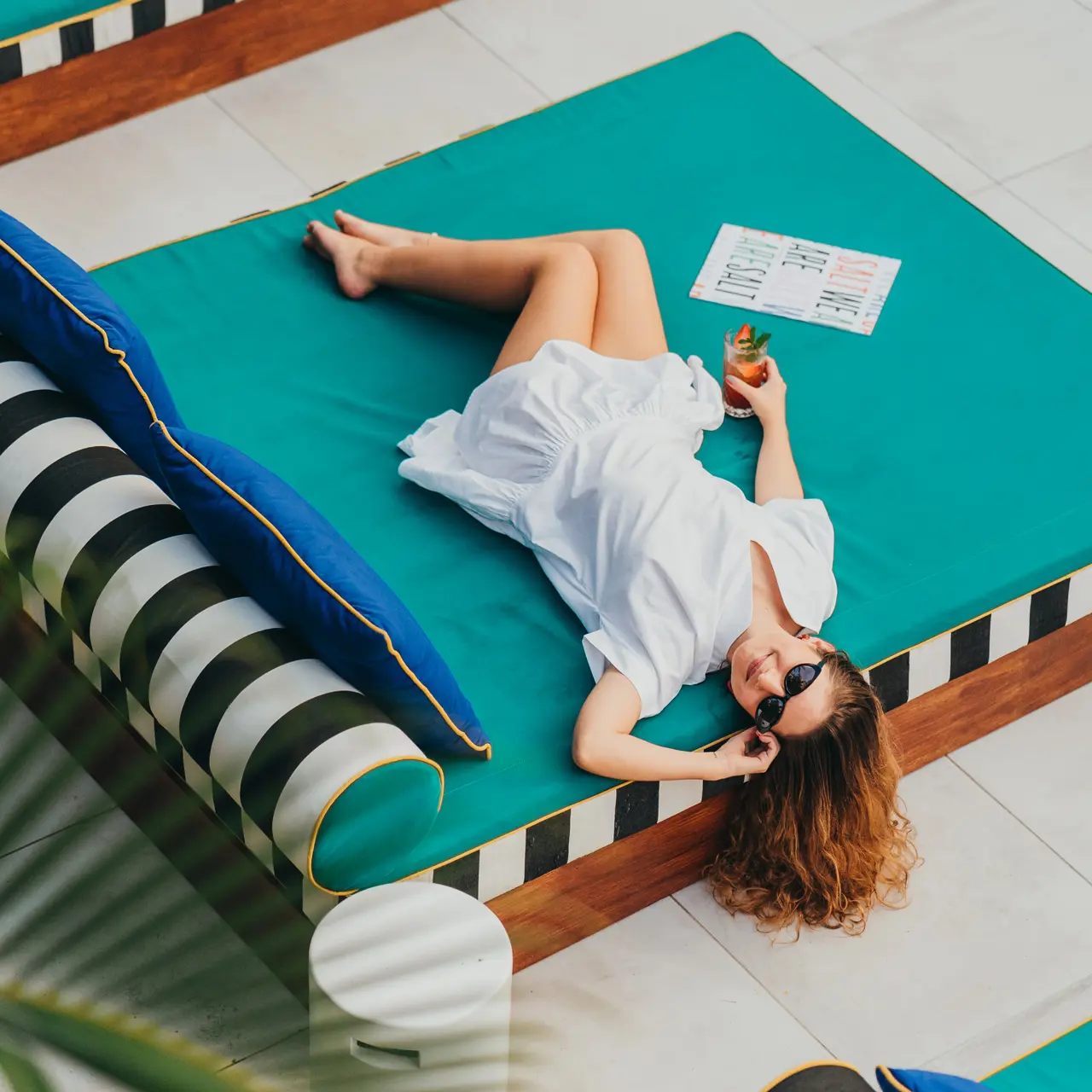Guest relaxing with a cocktail.
