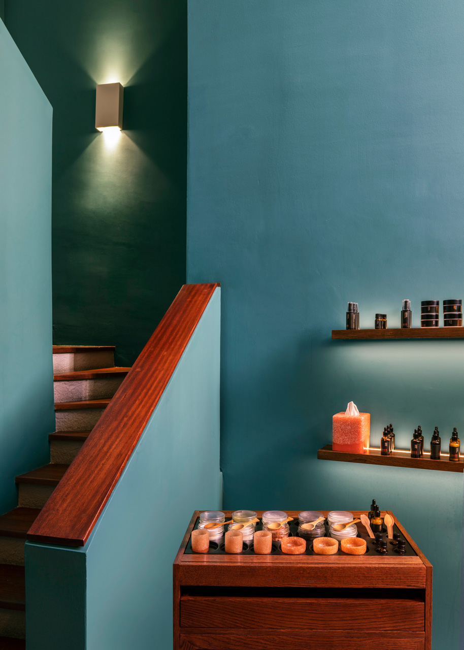 SALT Equilibrium spa products displayed on wooden shelves.