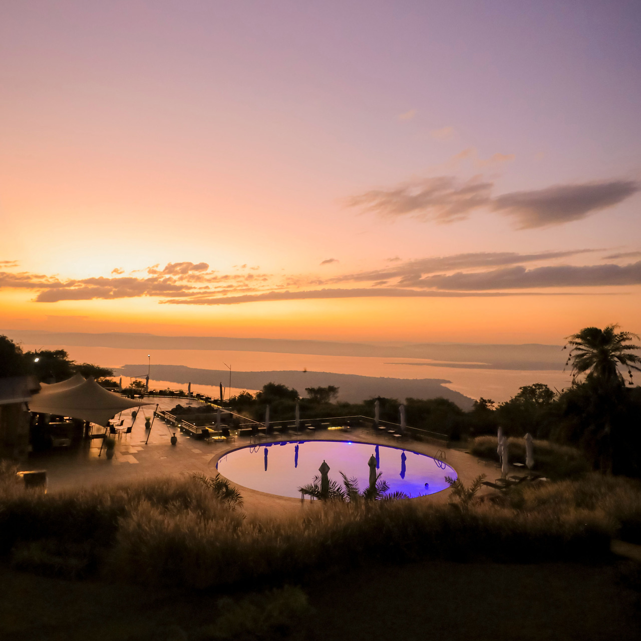 Sunset over the pool and Lake Ihema at SALT of Akagera.
