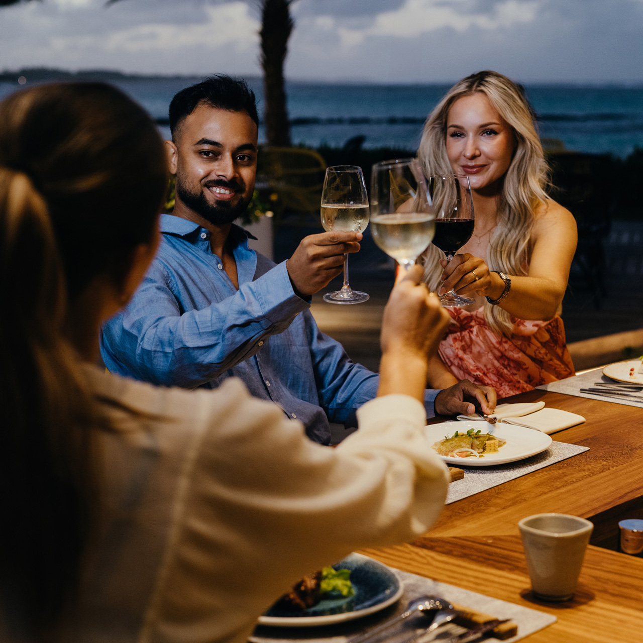 Guests enjoying dinner and wine at Tek Tek.