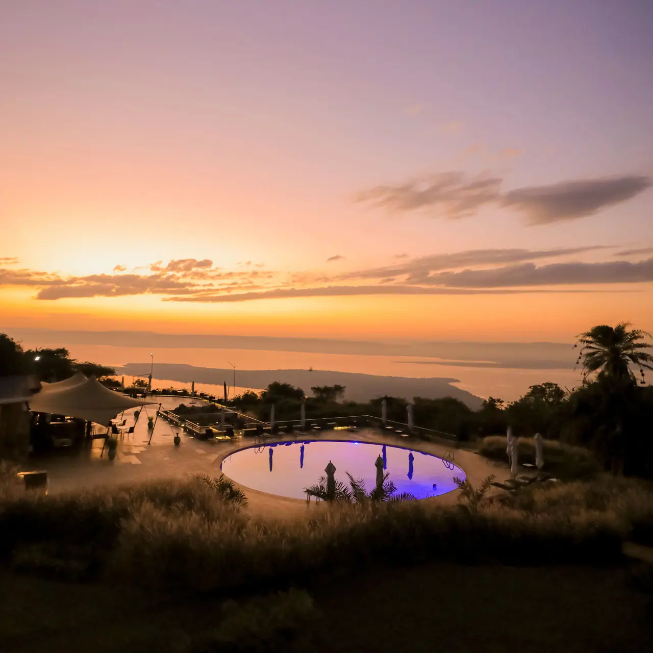 Sunset over the pool and Lake Ihema at SALT of Akagera.