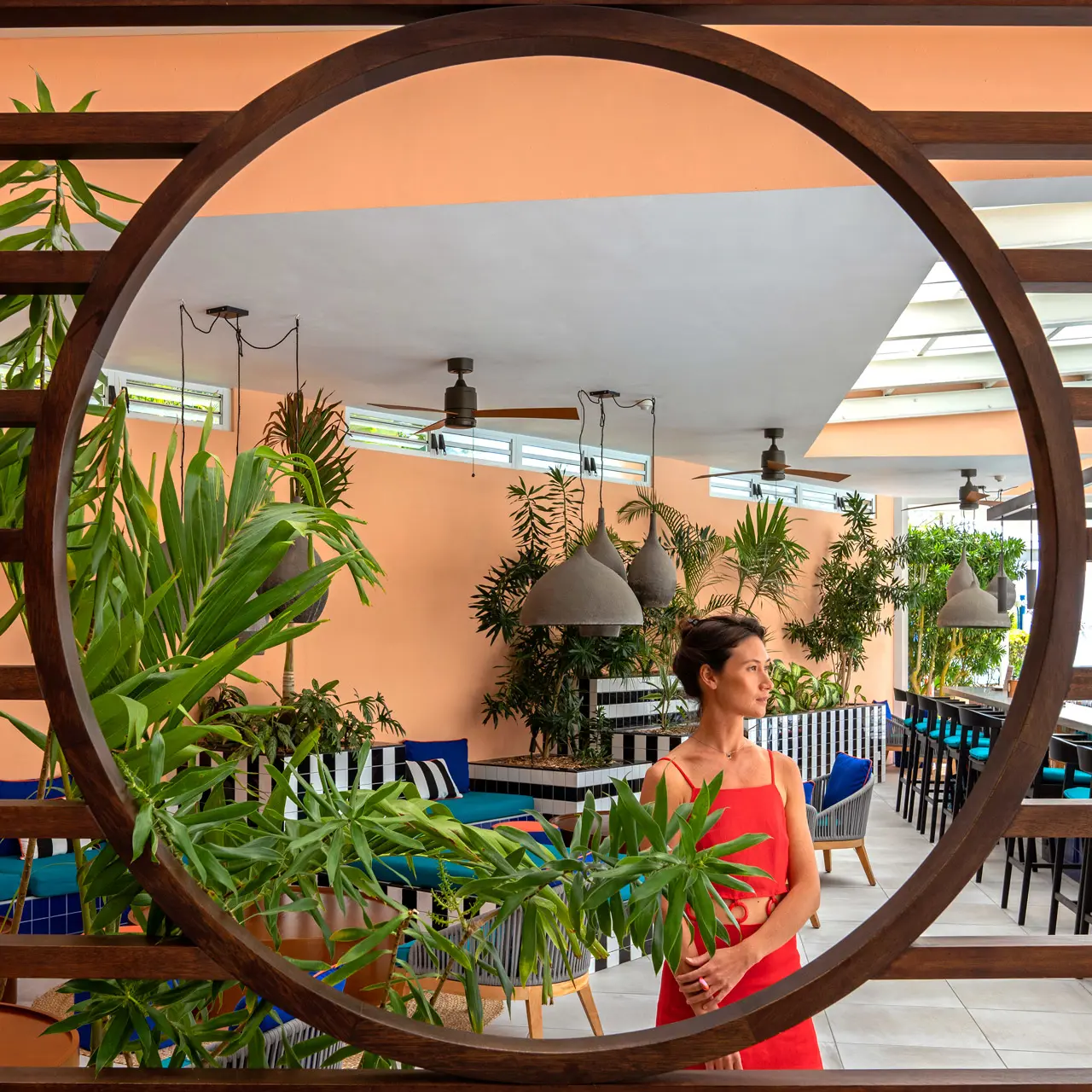 Guest admiring the tropical interiors of The Good Kitchen restaurant.