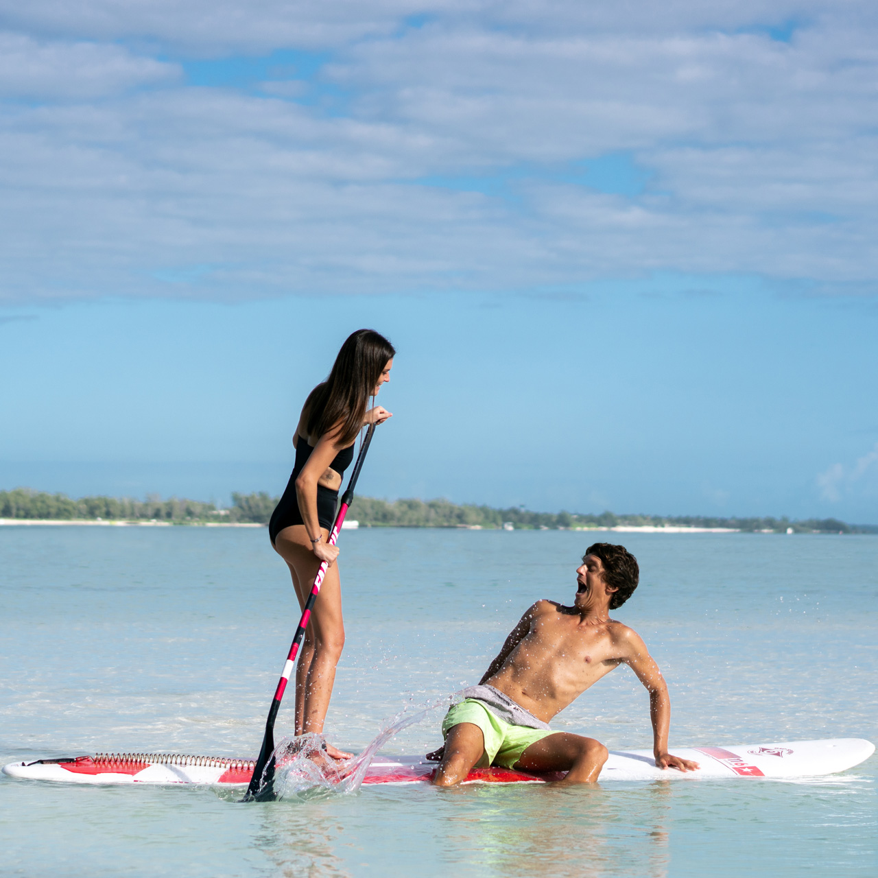 Guests enjoying stand-up paddle together.