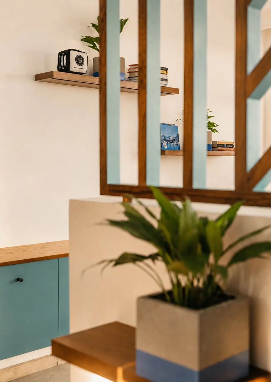 Contemporary hotel interior featuring wooden shelving, tropical plants, and thoughtfully curated decorative details.