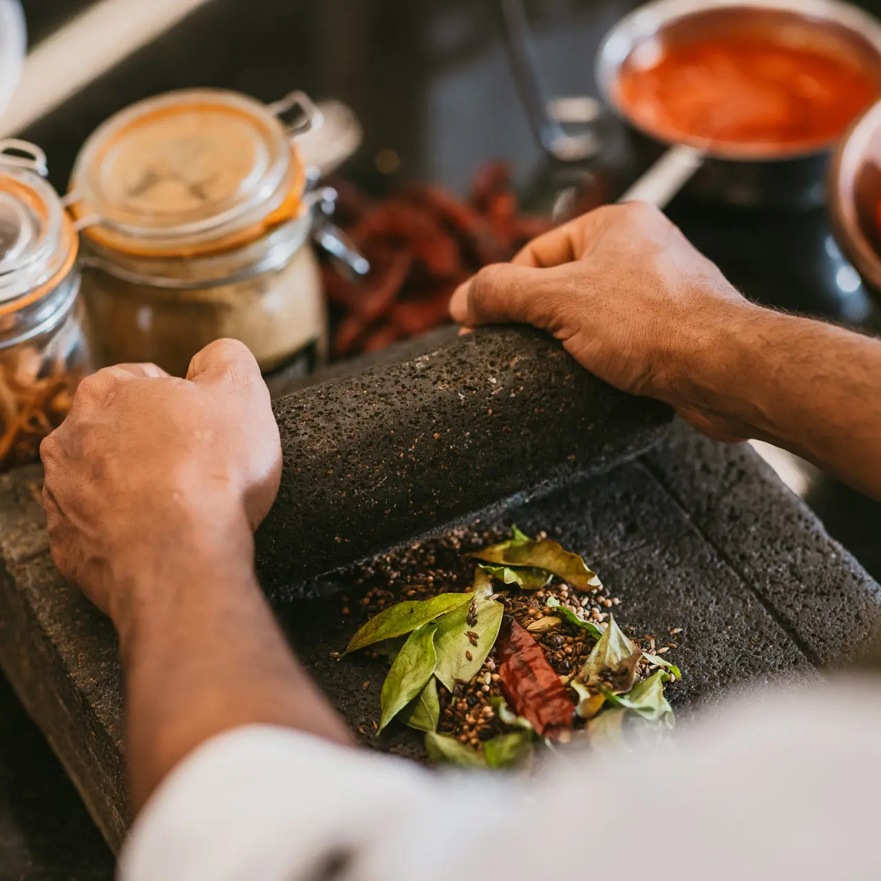Fresh spices being ground by hand.