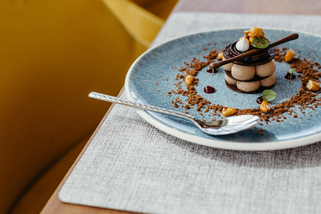Chocolate mousse dessert with crisp garnish.