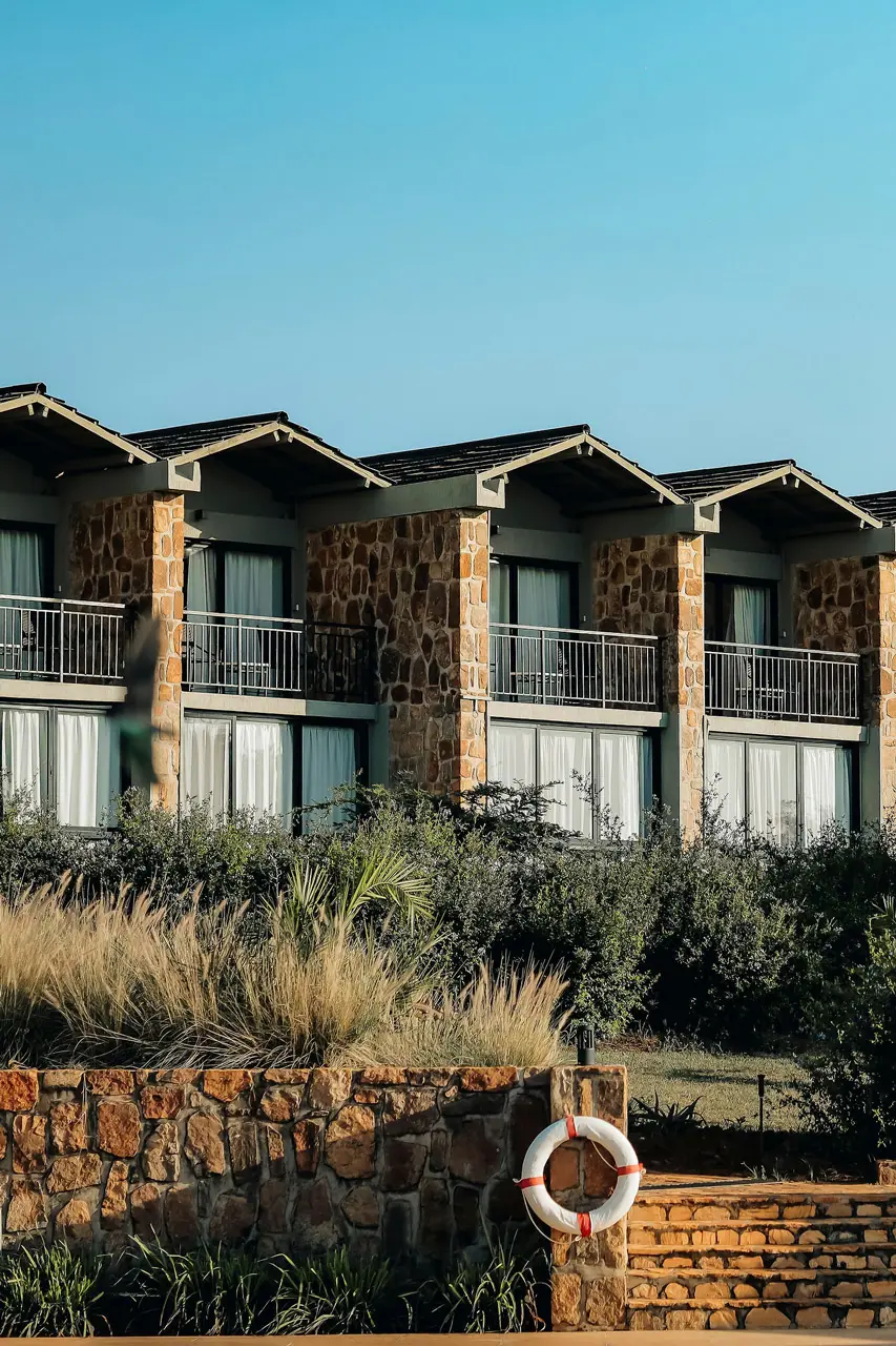 Stone façade and balconies at SALT of Akagera.